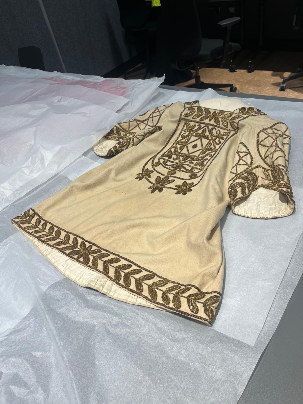 Beige costume with gold embroidery, London 1881.