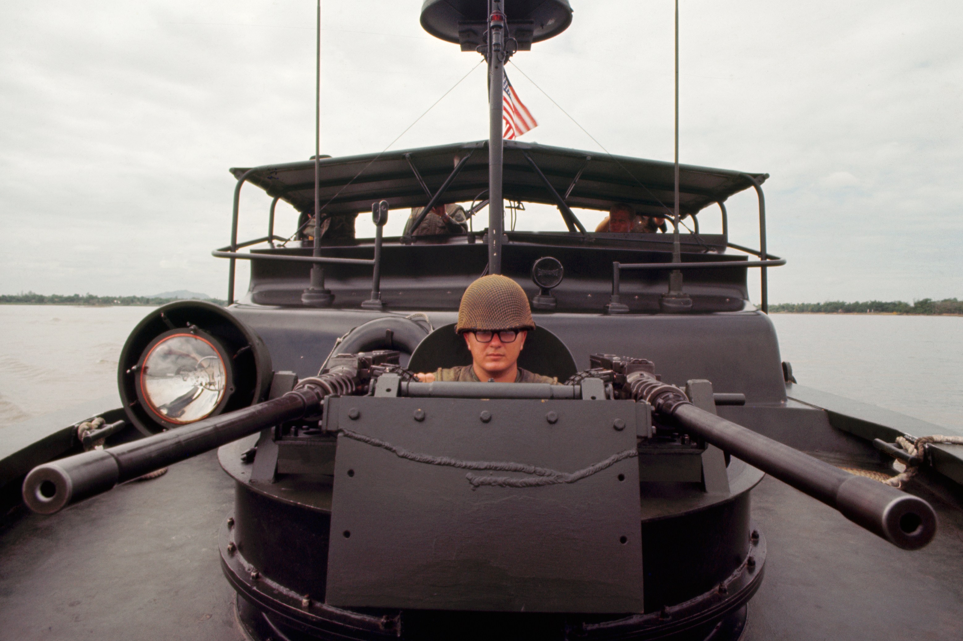 US BPR gunner on a vessel en route to Hue, Vietnam.