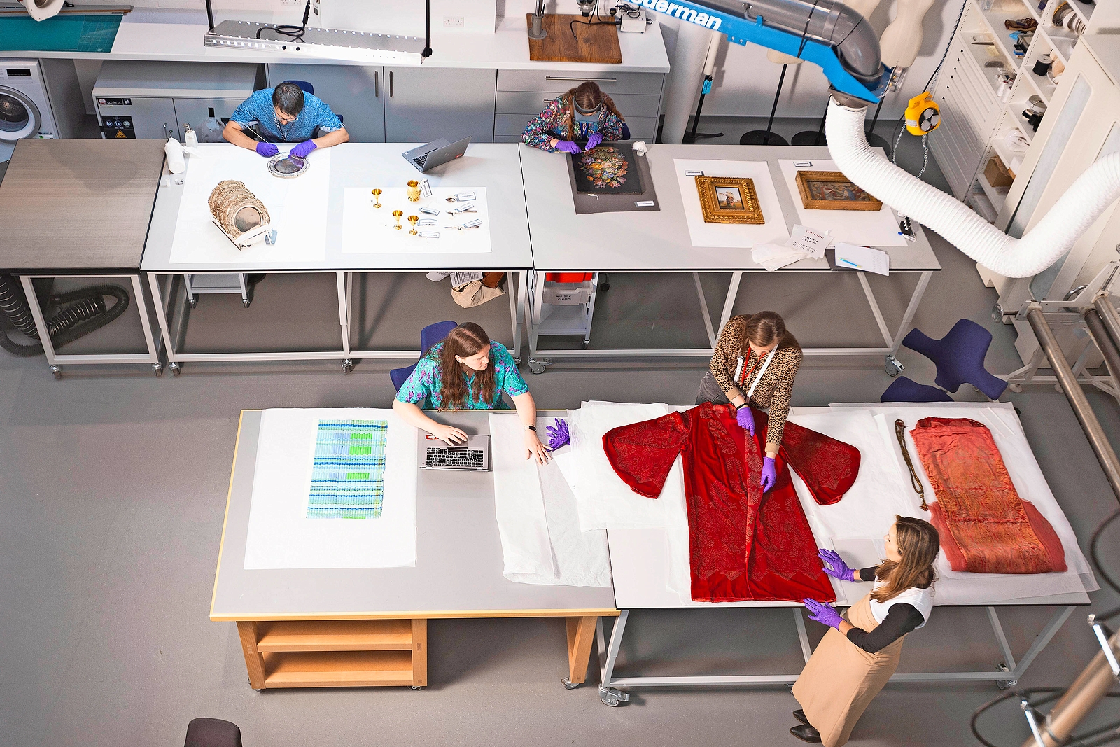 Conservators working in the V&A East Storehouse conservation studio.