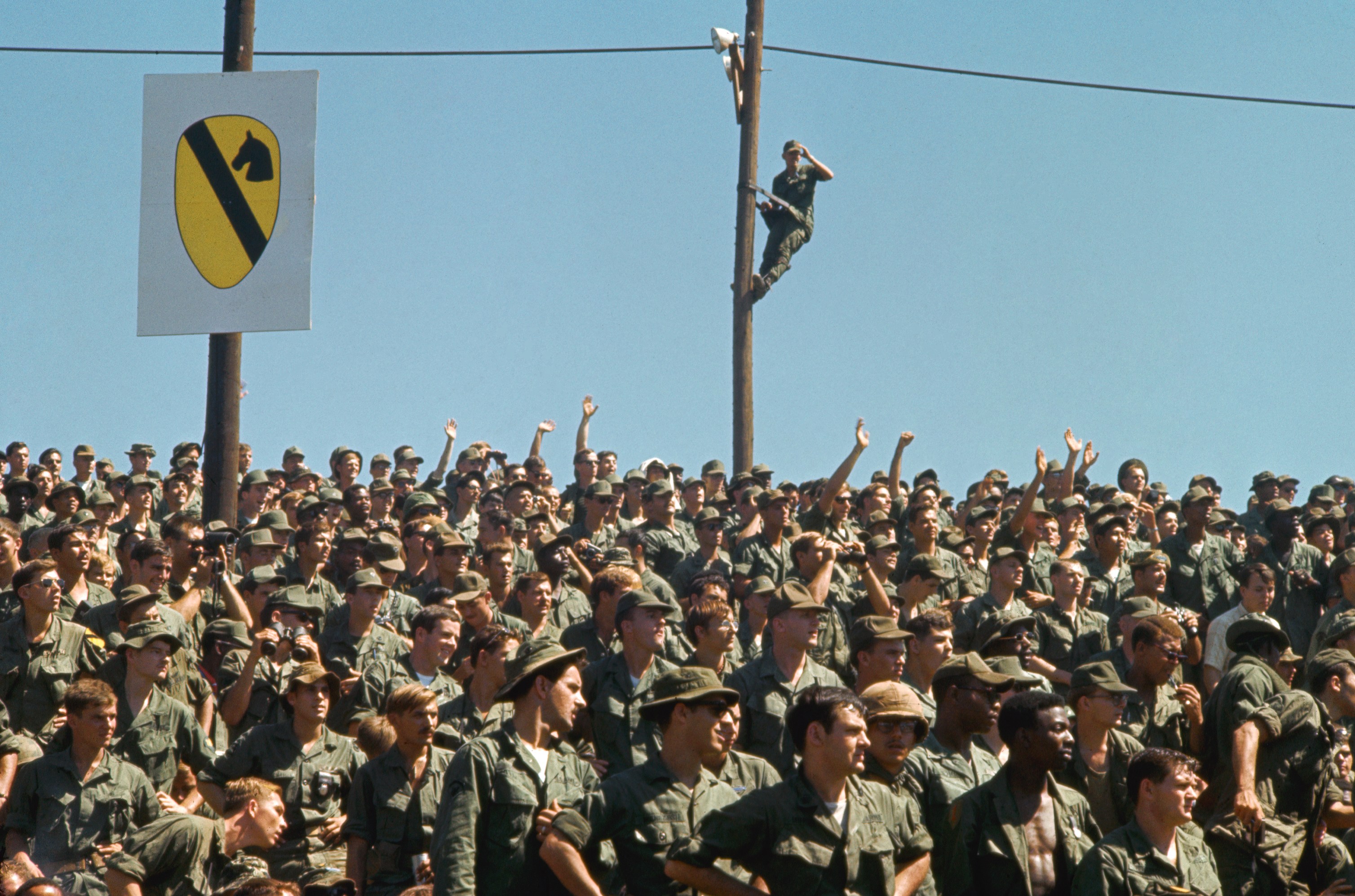 American soldiers enjoying a Bob Hope show in Vietnam.