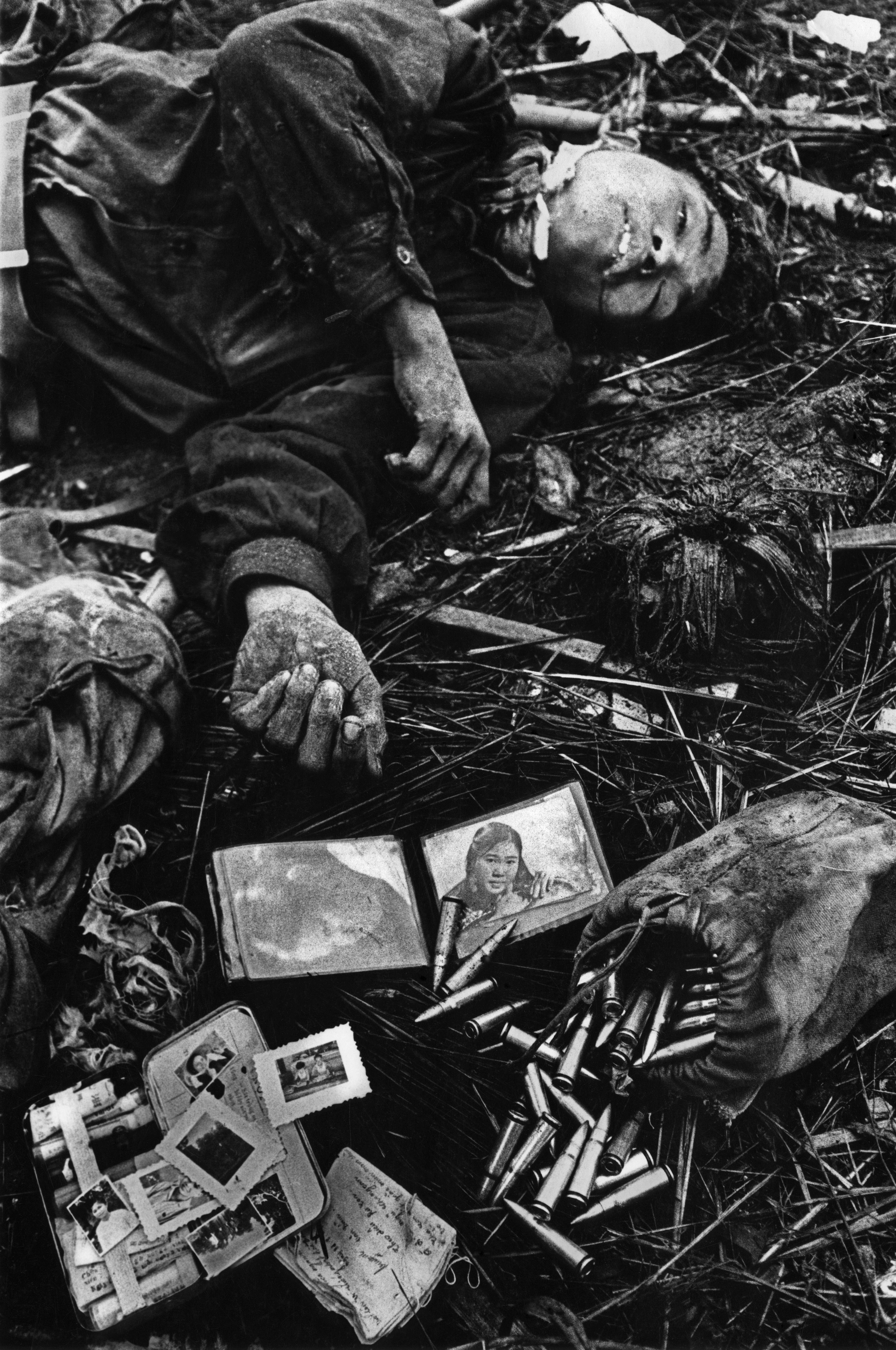 Dead North Vietnamese soldier with personal belongings and ammunition at the Battle of Hue during the Tet Offensive.