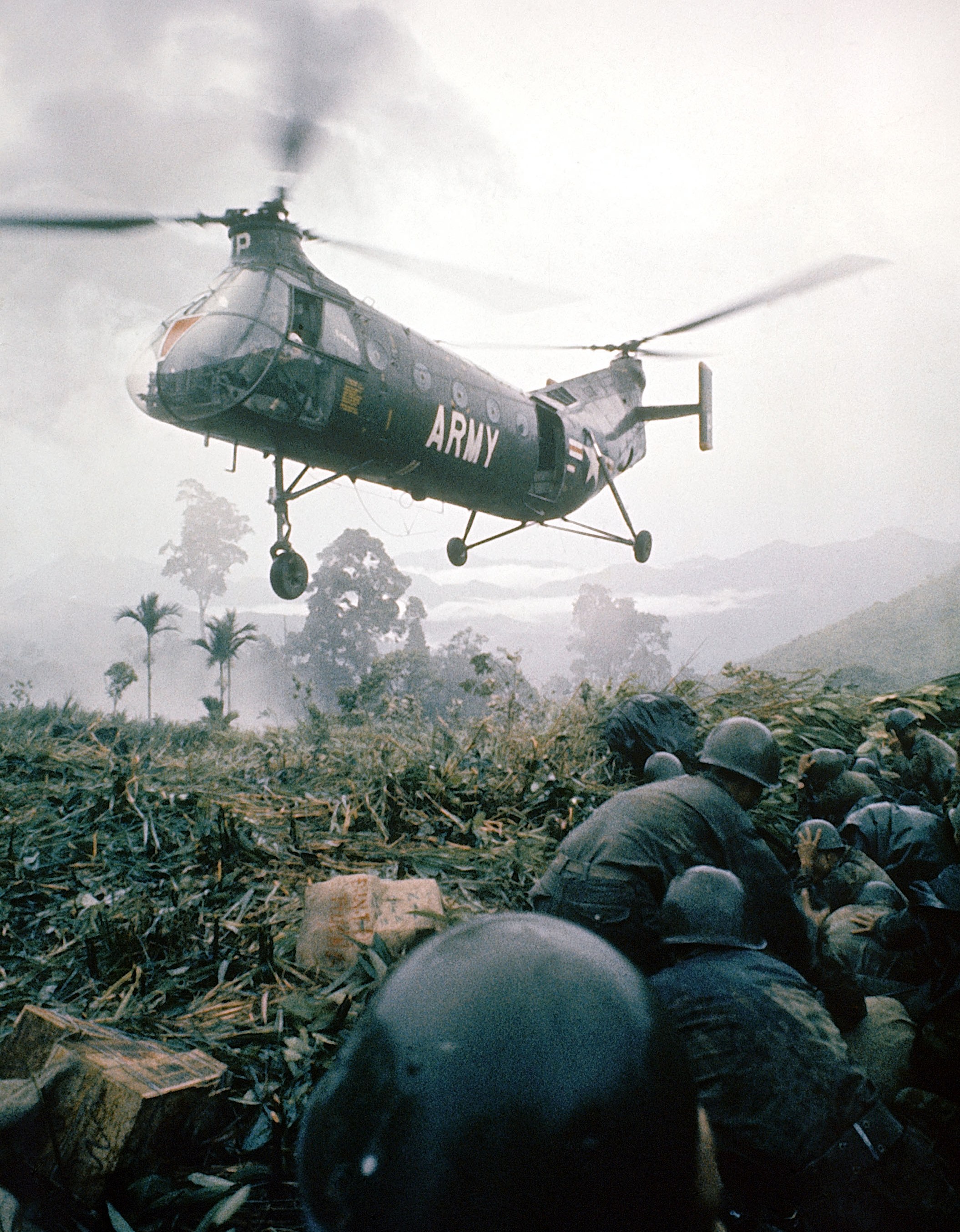 US Army helicopter over soldiers during the Vietnam War.