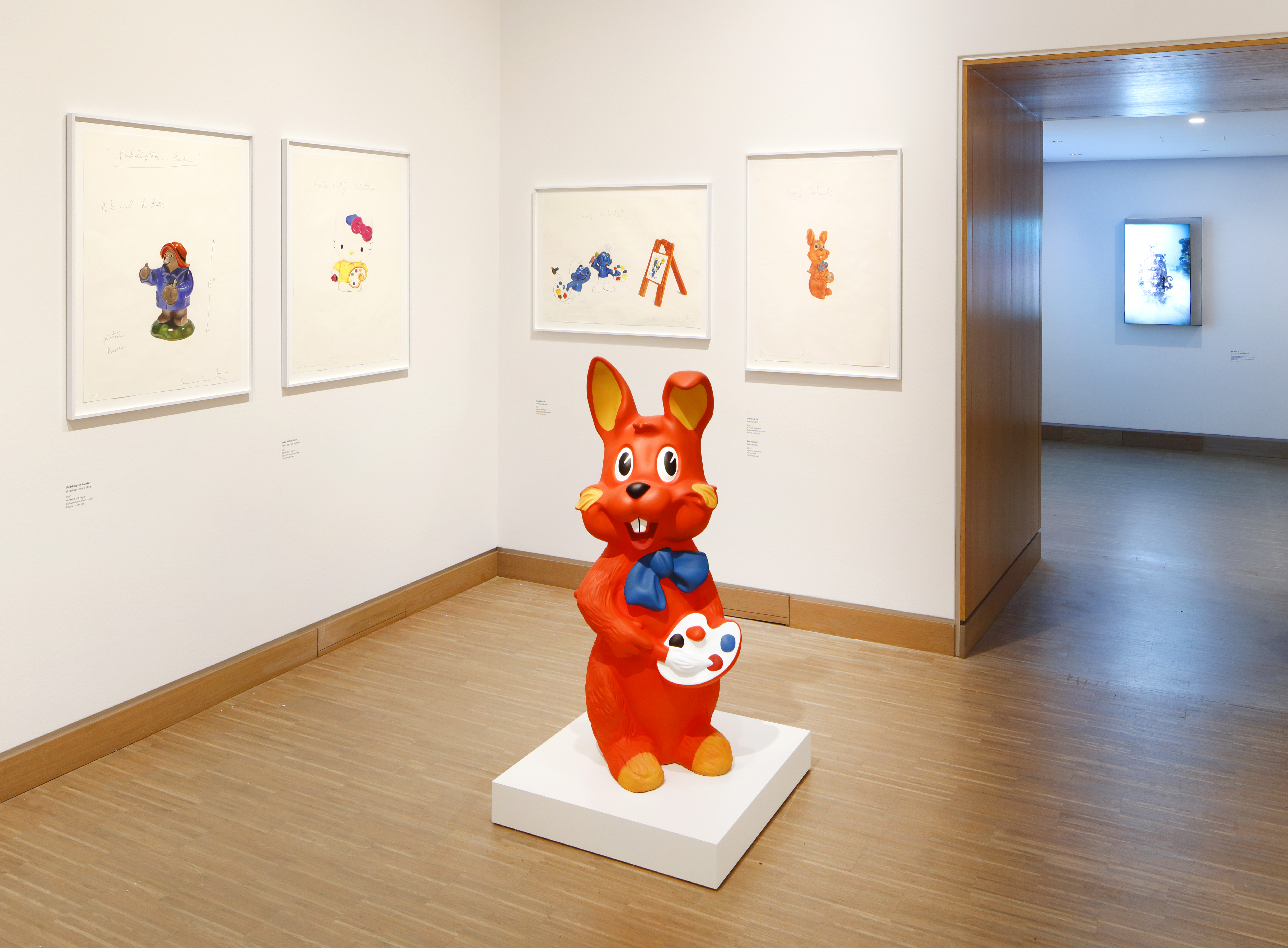 Installation view of Damien Hirst's drawings at Albertina Modern, Vienna, featuring a red rabbit sculpture.